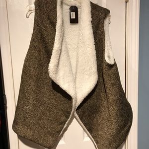 3/$10. Brown vest 100% polyester.